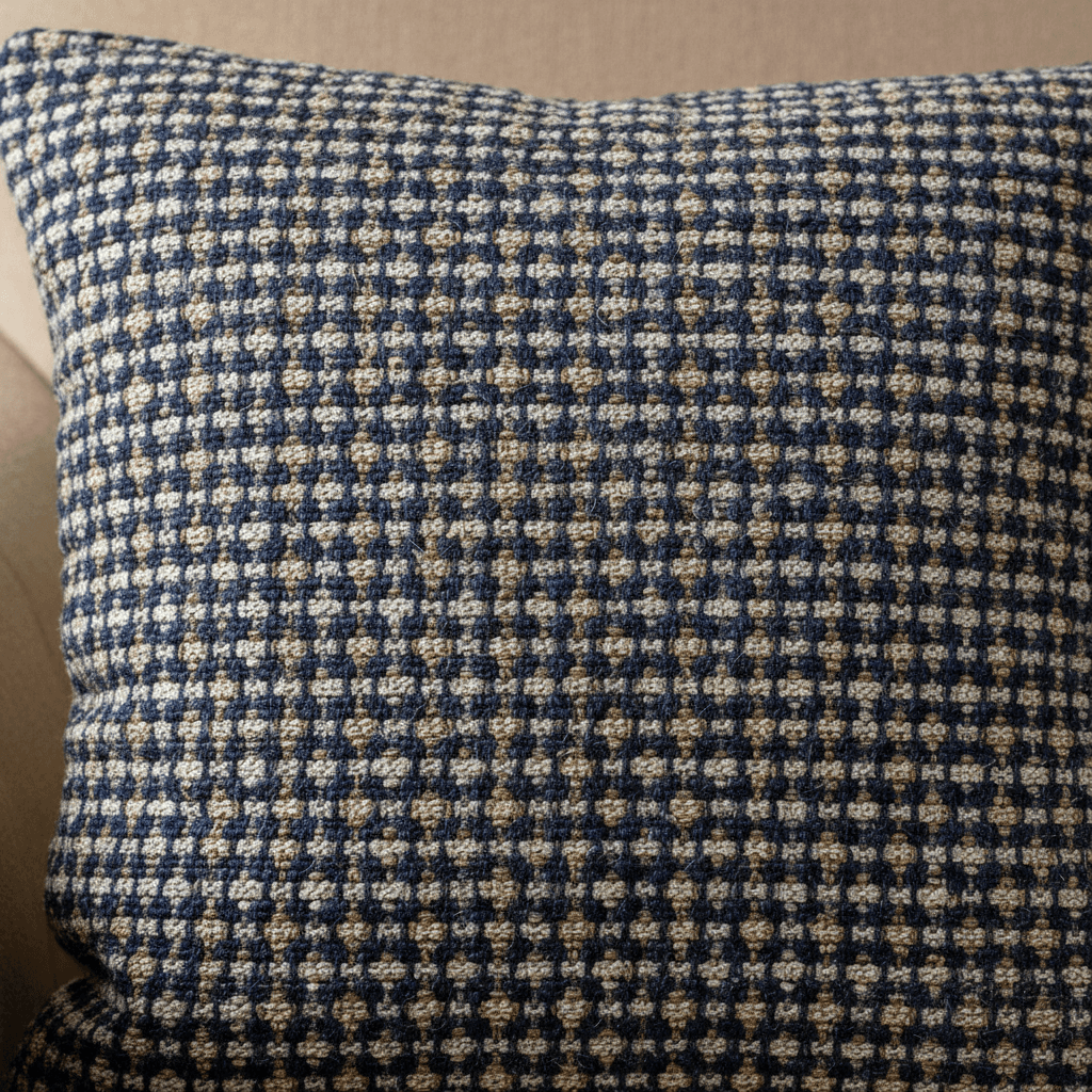 Close-up of woven cushion fabric showing detailed thread texture